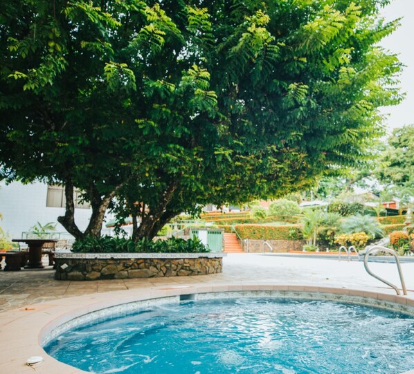 Outdoor pool, open 6:00 AM to 9:00 PM, pool umbrellas, pool loungers