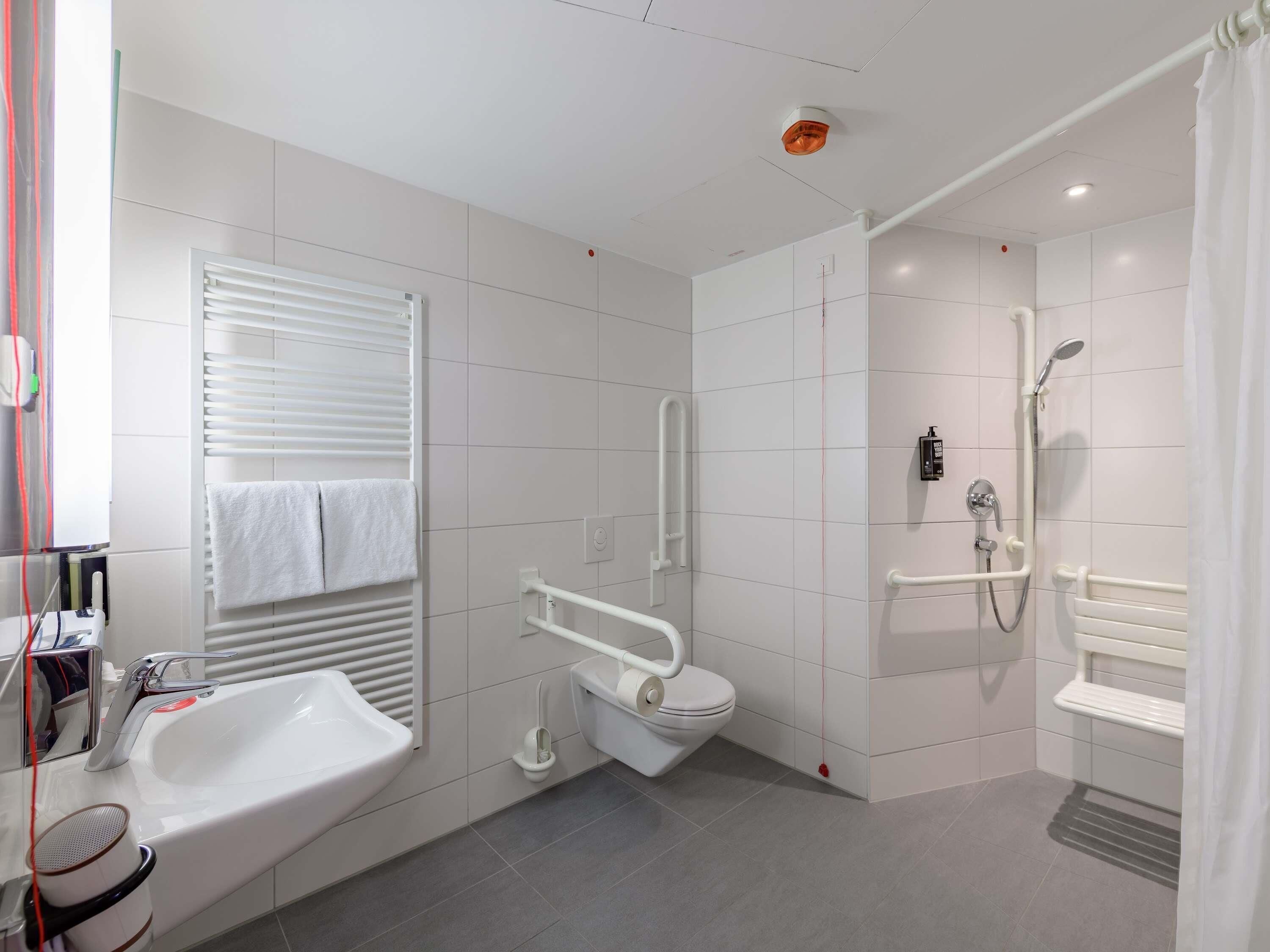 hypo-allergenic bedding, desk, laptop workspace, blackout curtains