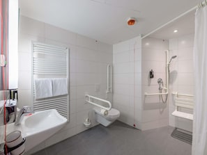 Hypo-allergenic bedding, desk, laptop workspace, blackout drapes