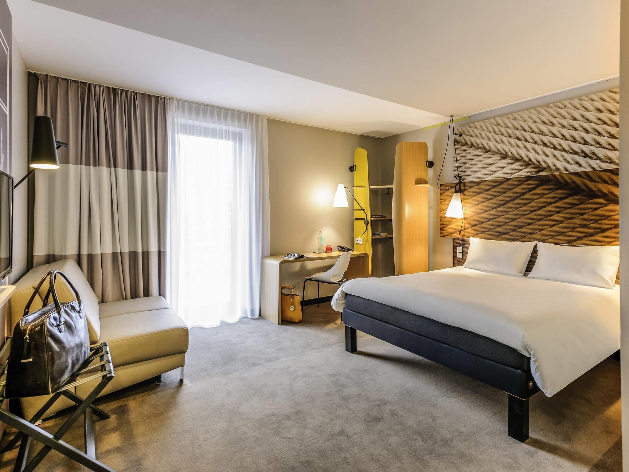 Hypo-allergenic bedding, desk, laptop workspace, blackout curtains