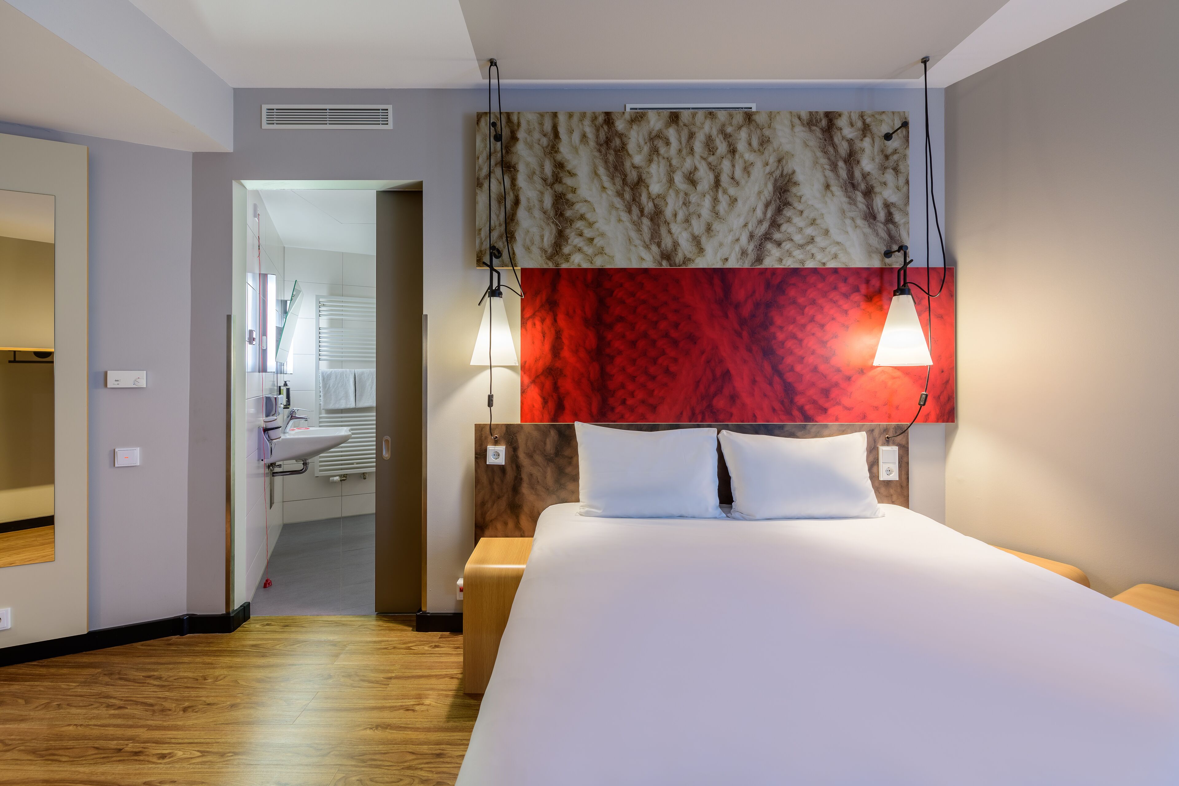 hypo-allergenic bedding, desk, laptop workspace, blackout curtains