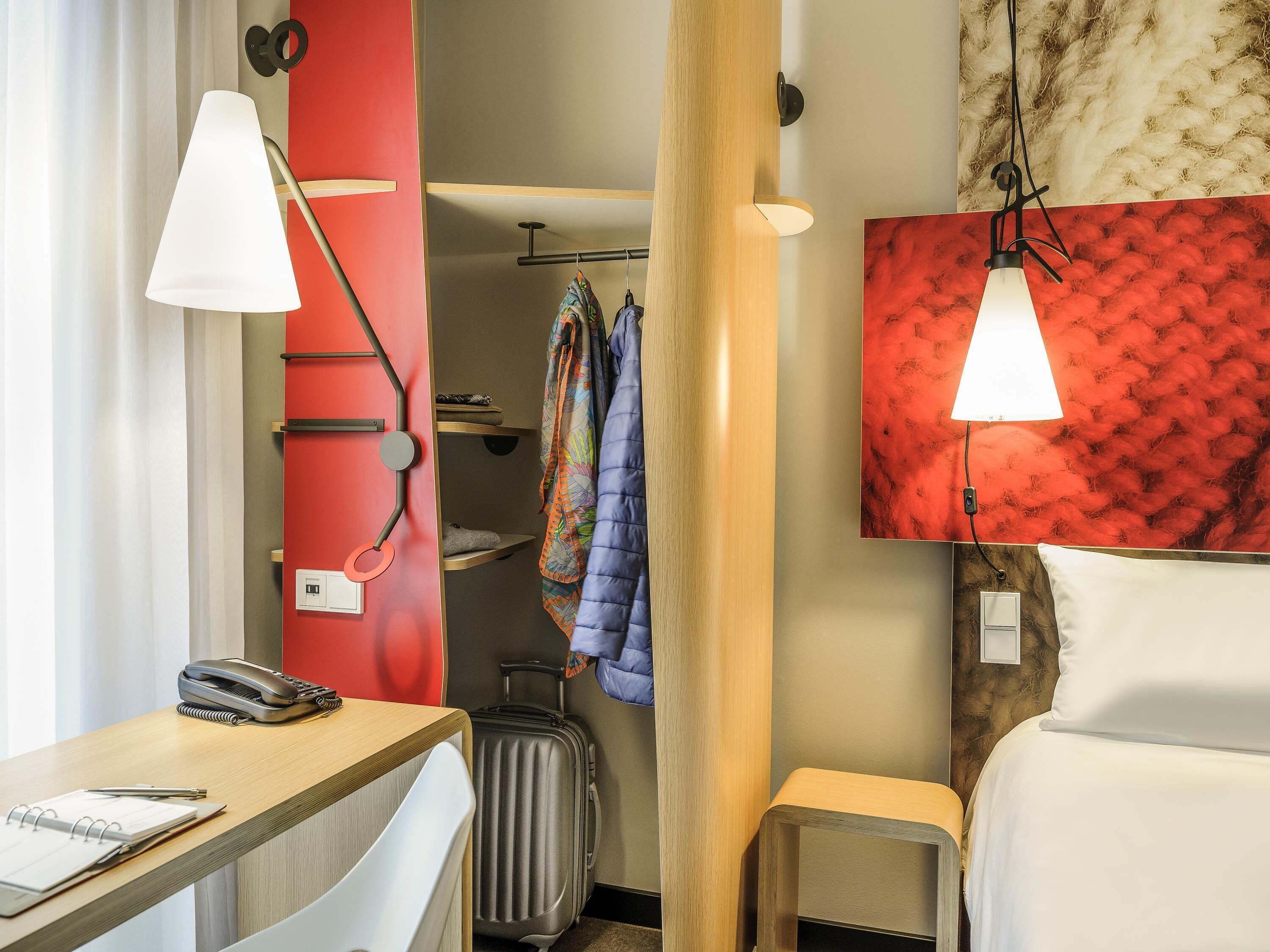 Hypo-allergenic bedding, desk, laptop workspace, blackout drapes