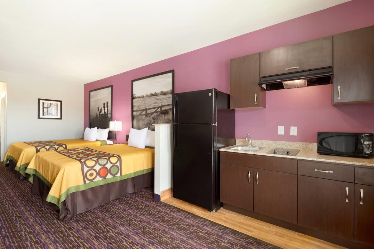 Room, 1 Queen Bed, Non Smoking (Efficiency) | Desk, iron/ironing board, free cribs/infant beds, rollaway beds