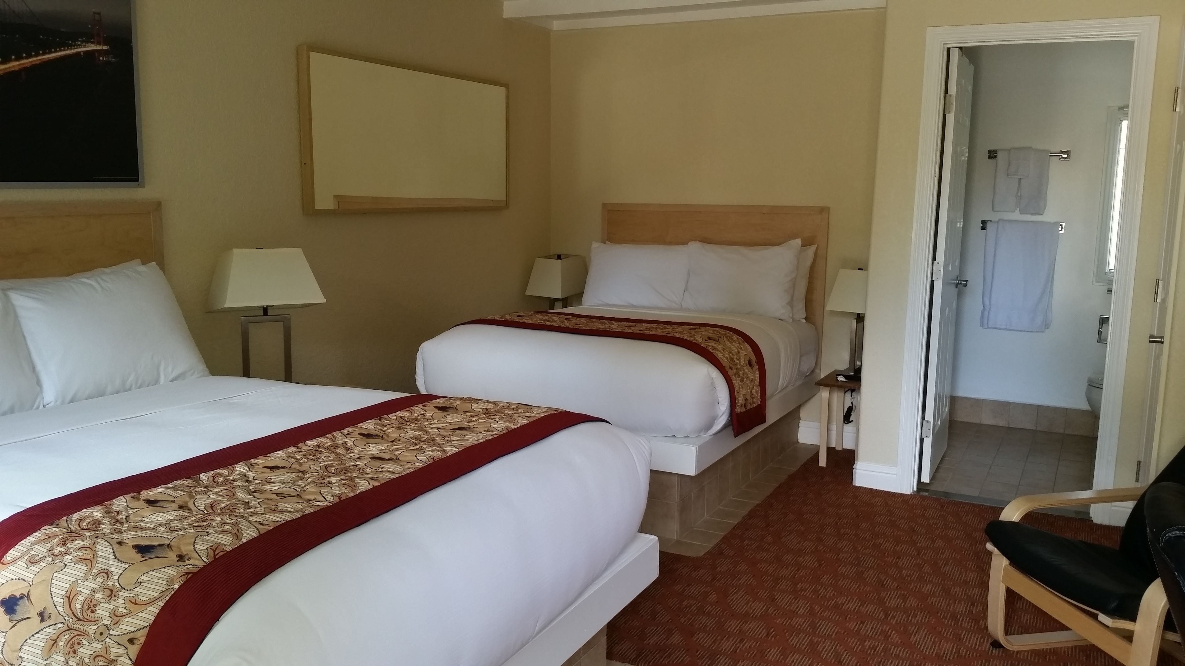 deluxe room, 2 double beds | desk, iron/ironing board, free cots/infant beds, free wifi