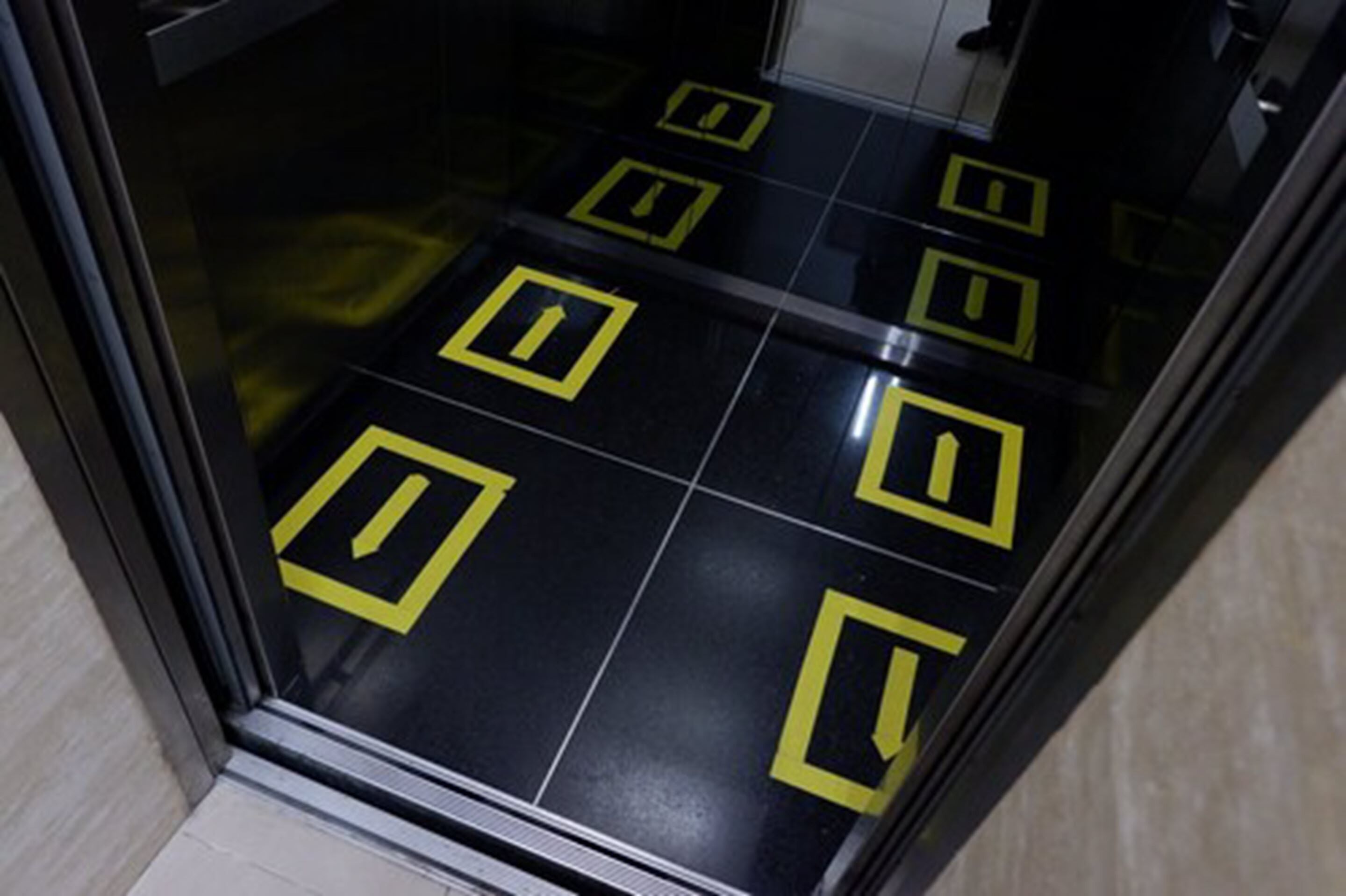 A floor with directional arrows indicating the flow of foot traffic.
