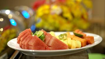 A plate of watermelon and cantaloupe on a table.