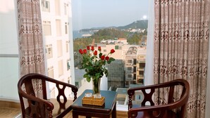 Senior Room, Partial Ocean View | Living area | Flat-screen TV