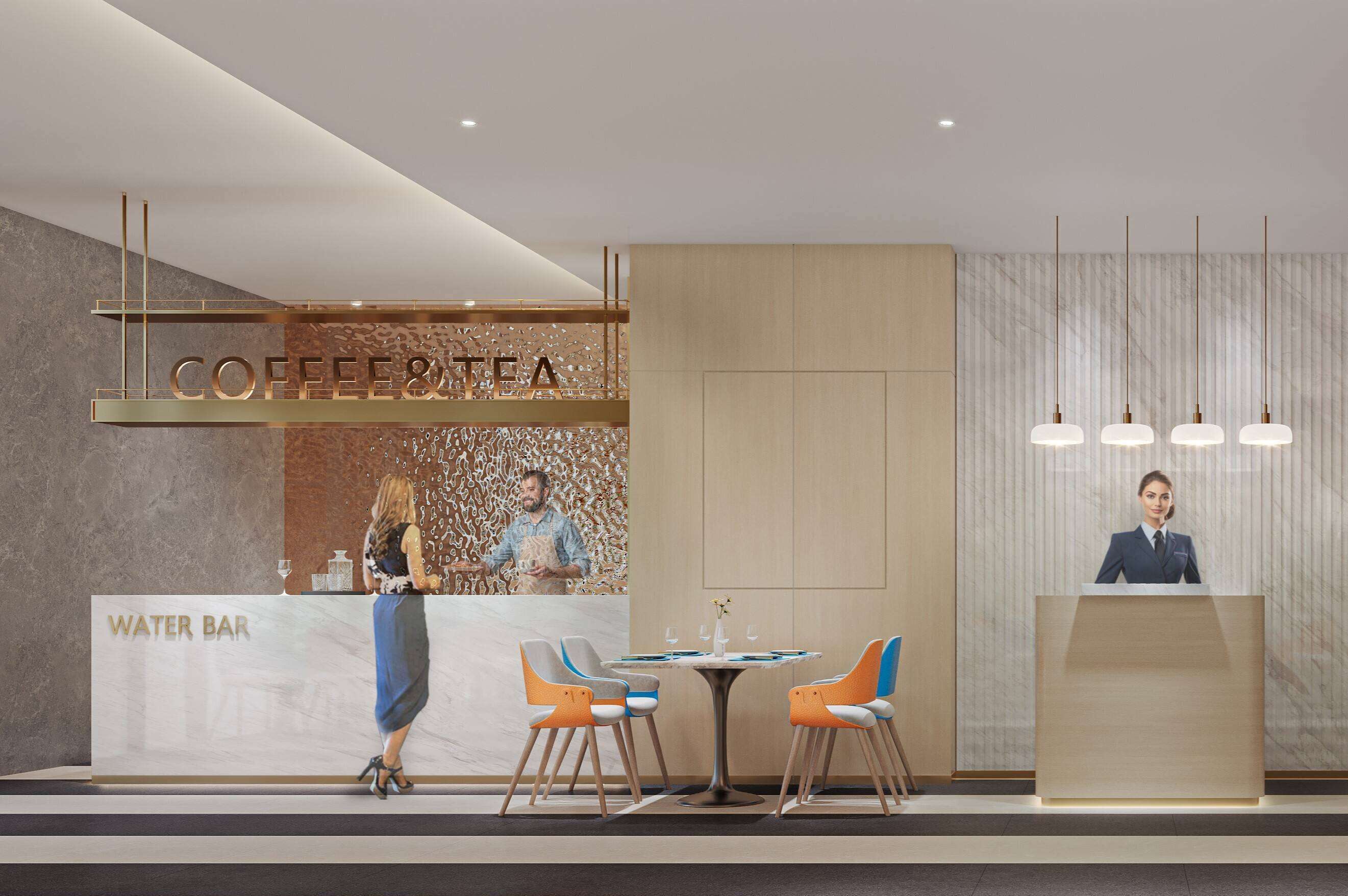 A modern reception area with a coffee and tea counter, a water bar, and a reception desk.
