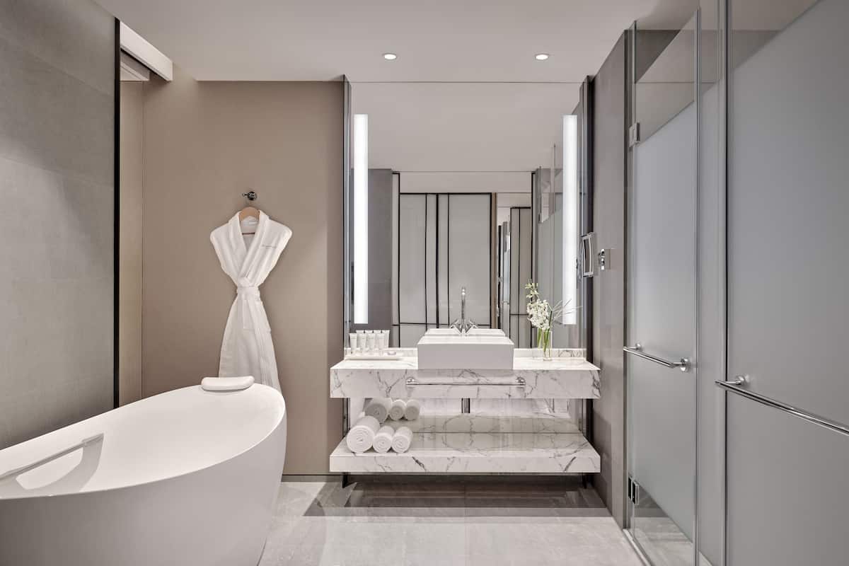 separate bathtub and shower, free toiletries, hair dryer, slippers