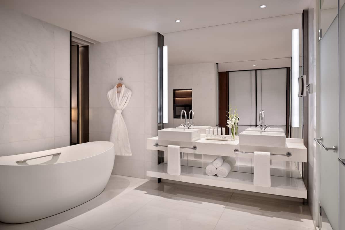 separate bathtub and shower, free toiletries, hair dryer, slippers