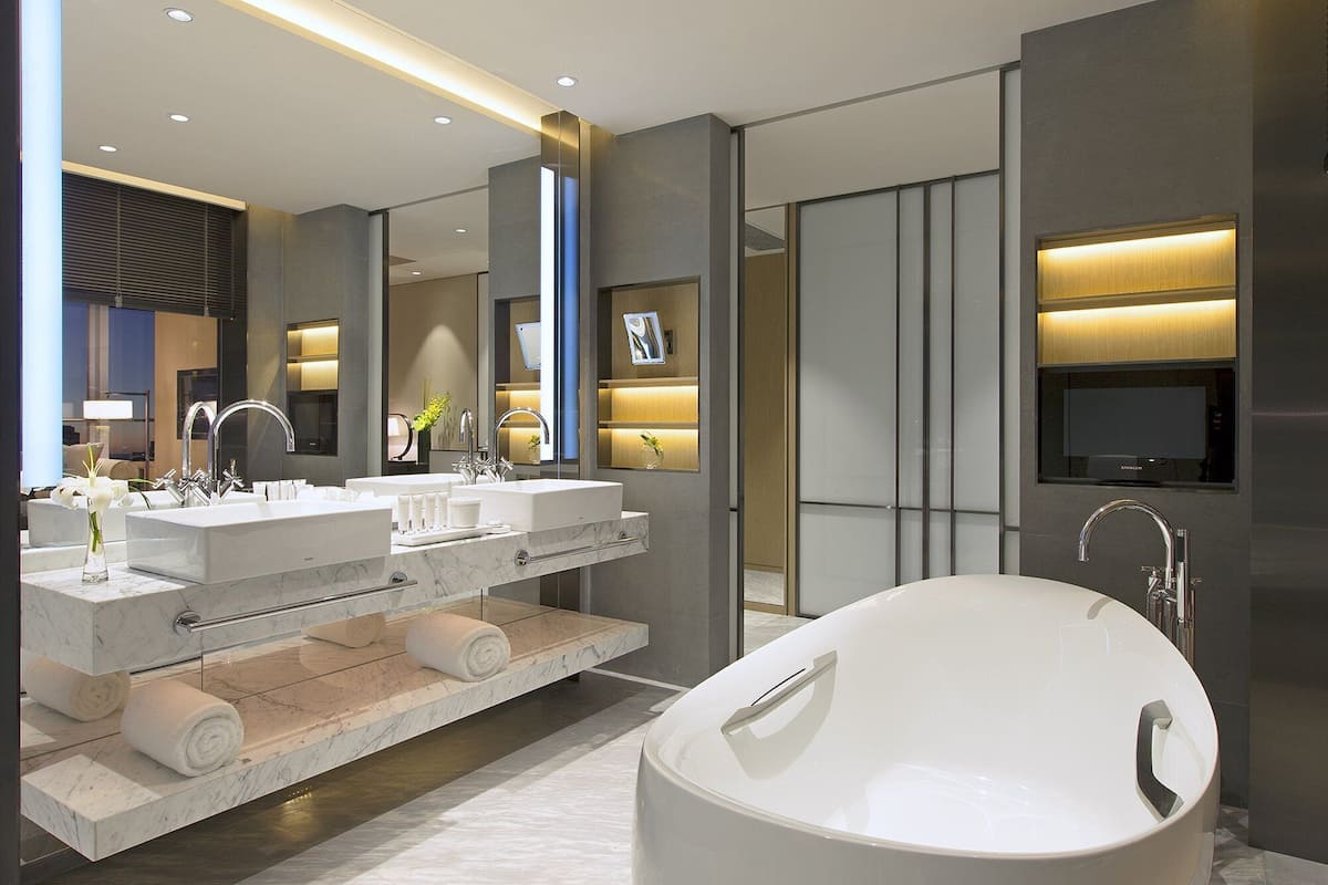 grand deluxe | bathroom | separate bathtub and shower, free toiletries, hair dryer, slippers