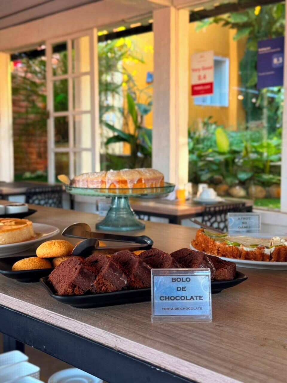 A dessert display with a sign indicating chocolate treats.