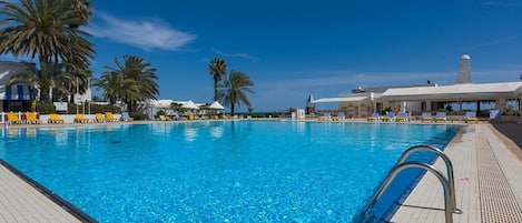 Indoor pool, seasonal outdoor pool, pool umbrellas, pool loungers