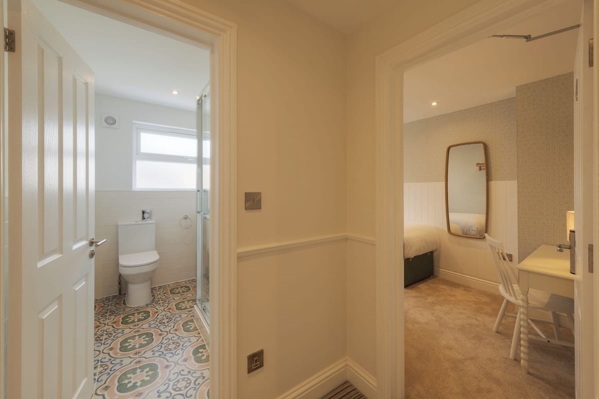 designer toiletries, hair dryer, towels, soap