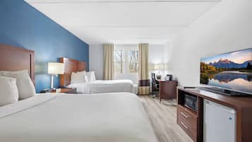 Premium bedding, desk, laptop workspace, blackout drapes