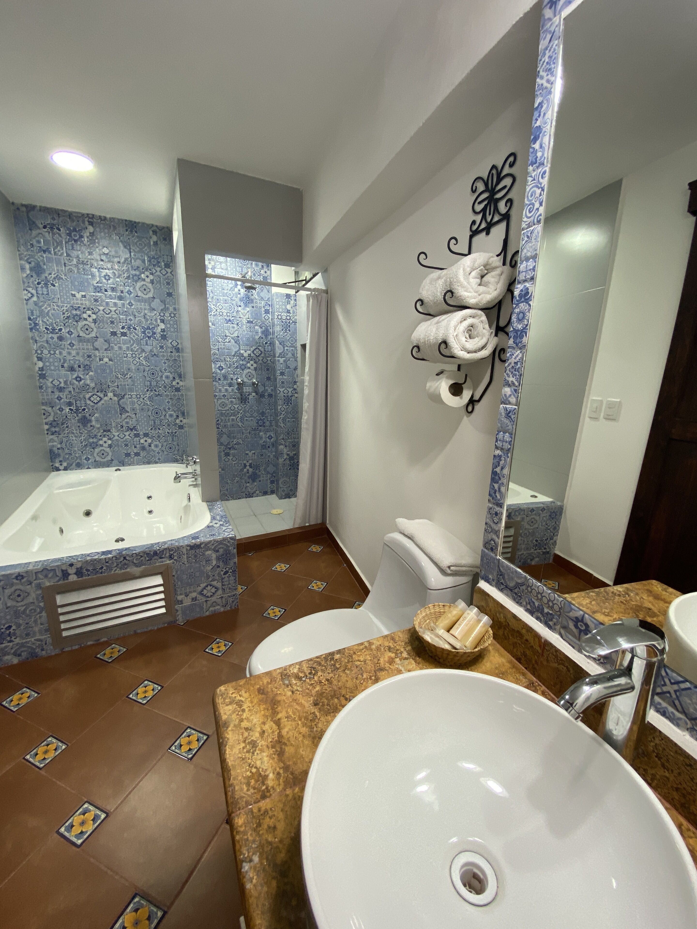 Romantic Suite, Jetted Tub | Bathroom | Shower, designer toiletries, hair dryer, towels