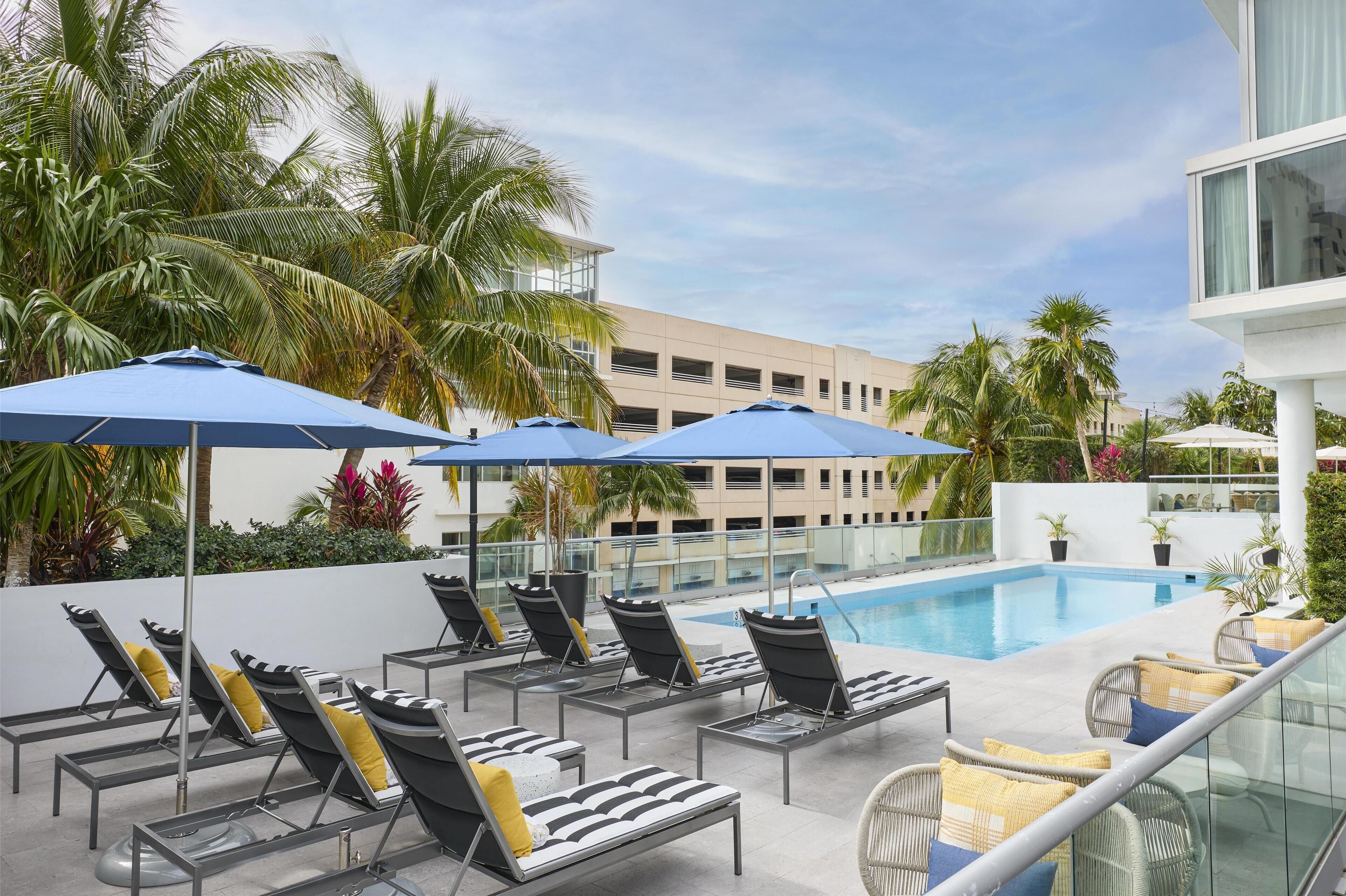 outdoor pool, free pool cabanas, pool umbrellas