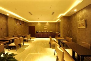 A conference room with a long table, chairs, and a podium. - Tangyue Hotel (Yan'an)