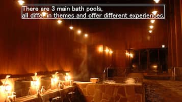 Three bathing stations offer ample space for relaxation, set amidst a high ceiling and wooden paneling.