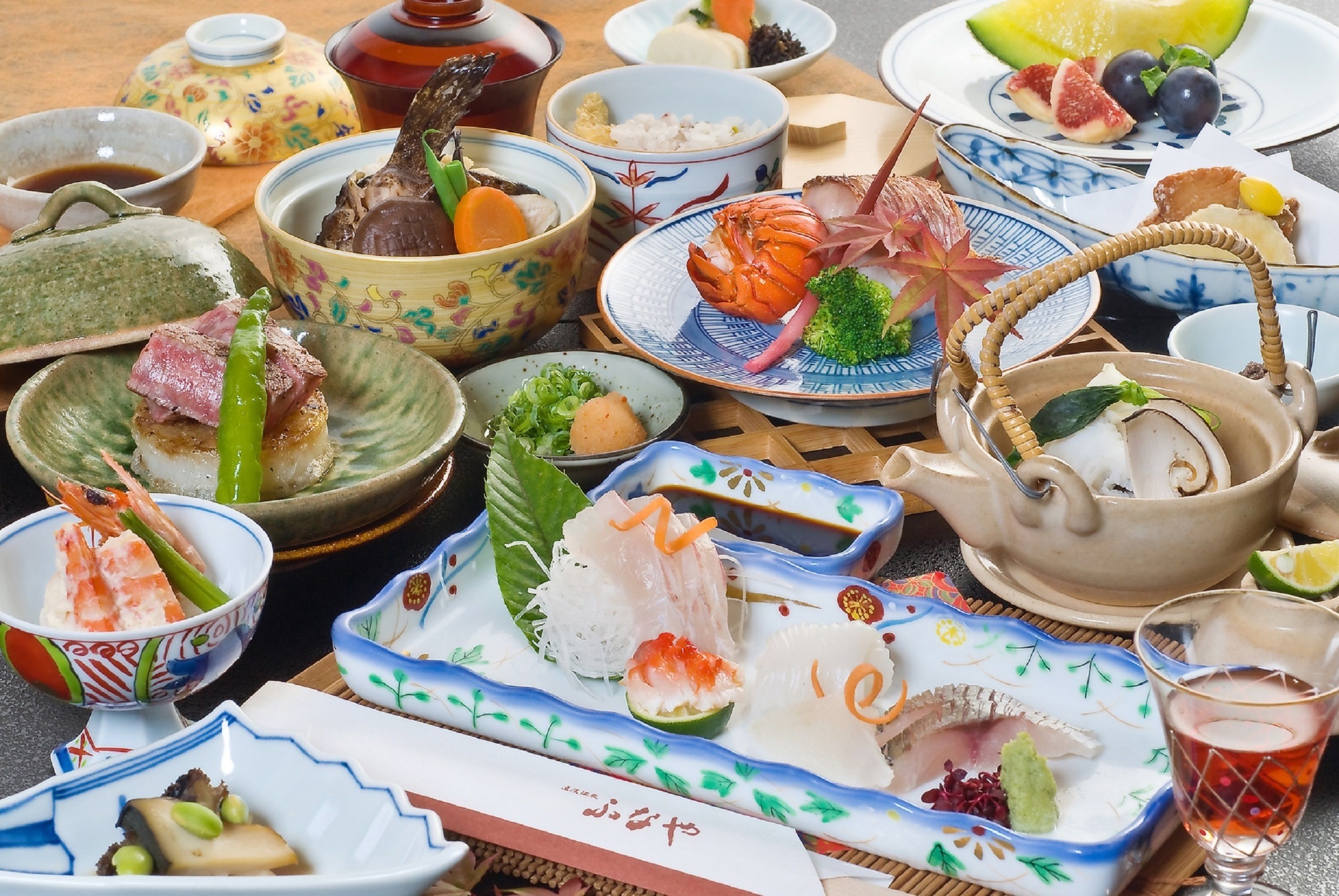 A variety of dishes and bowls on a table, likely for a meal.