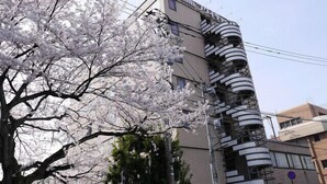 A multi-story building with a distinctive spiral staircase on the exterior. - Hotel Fukui Castle (Fukui)