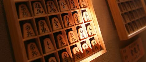 A display of calligraphy with wooden frames and illuminated signs.