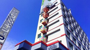 A multi-story building with a prominent 'Sunshine Hotel' sign on the facade. - Business Hotel Sunshine Takamatsu (Takamatsu)