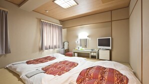 A hotel room with two beds, a desk with a computer, a mirror, and a window with curtains. - Business Hotel Sunshine Takamatsu (Takamatsu)
