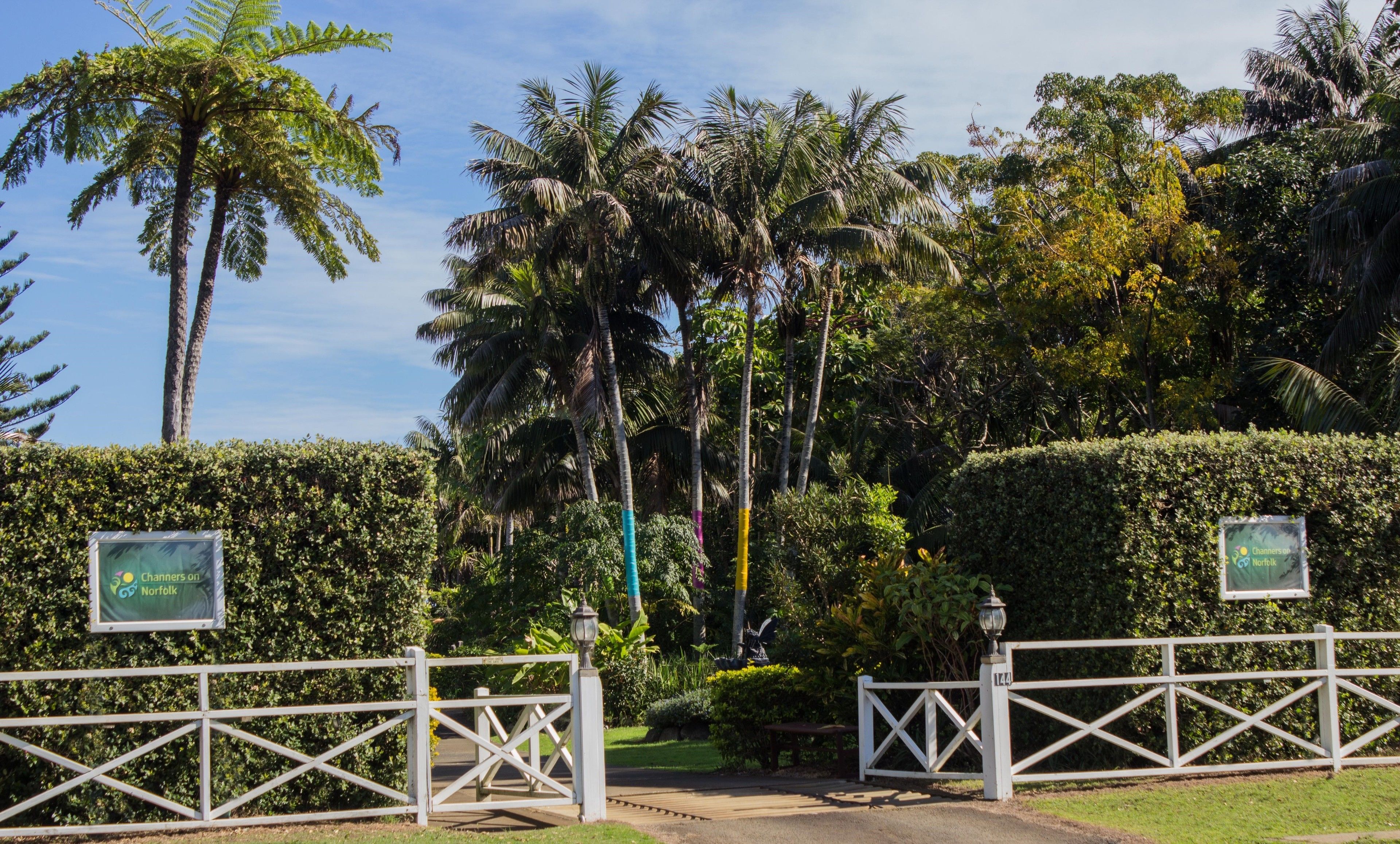 A gated entrance with a sign reading "Channerys on Norfolk" and a white gate.