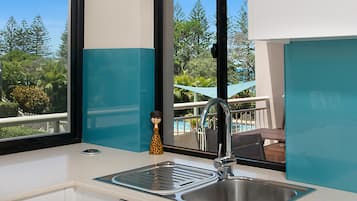 Superior 2 Bedroom Apartment - Partial Ocean View  | Private kitchen | Full-sized fridge, oven, stovetop, dishwasher