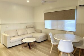 Deluxe 2 Bedroom Poolside Cabin - S6 | Living area | TV, DVD player - Discovery Parks – Lake Tinaroo (Tinaroo)