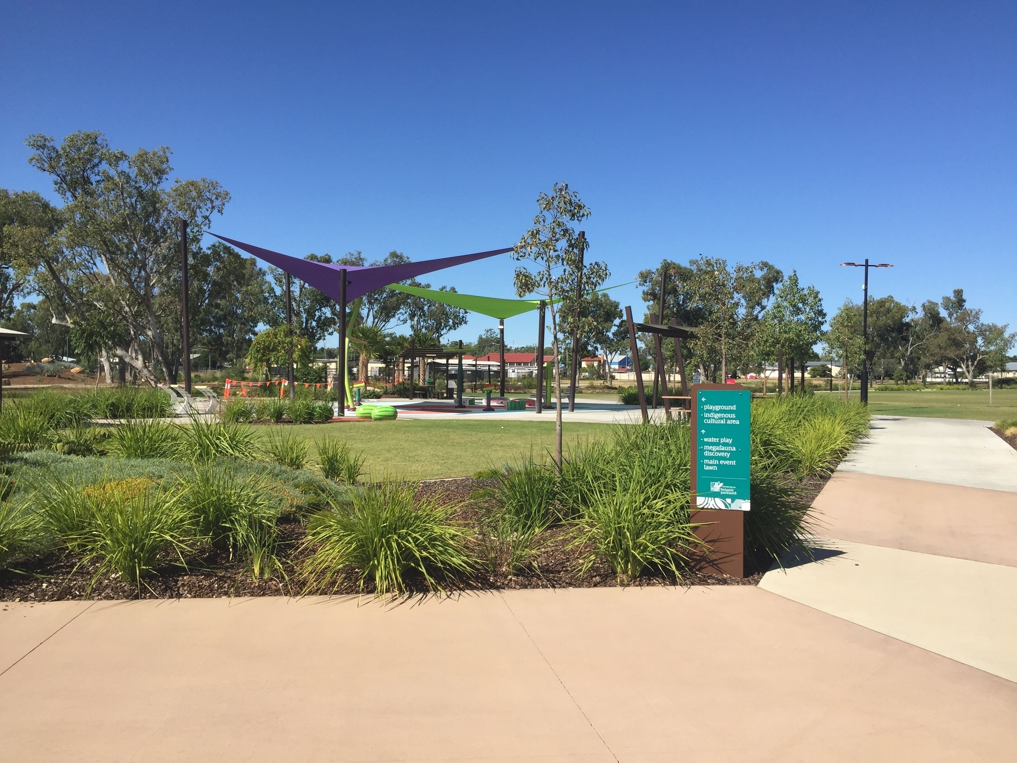 A park with a playground, water play, and a main event lawn.
