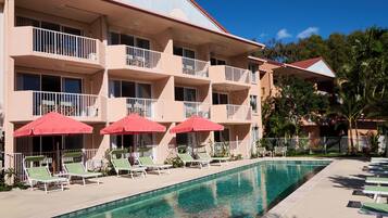 Outdoor pool, pool umbrellas, sun loungers