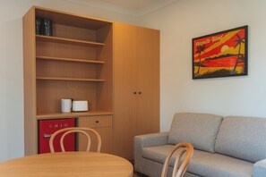 Two-Bedroom Suite with Balcony | Living area | 45-inch Smart TV with digital channels - Hotel Allen (North Ward)