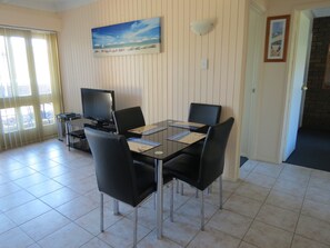 Standard Apartment, 2 Bedrooms, Non Smoking, Kitchen (Pool side) | Living area | 40-inch Smart TV with digital channels, DVD player - Chapman Court Holiday Units (Merimbula)