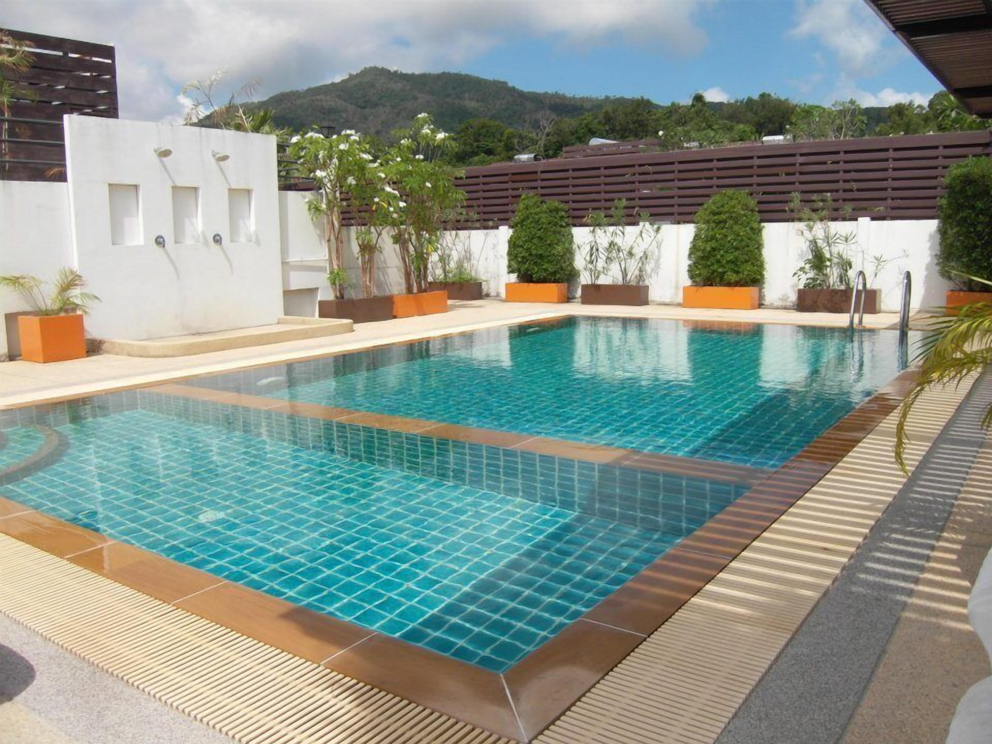 outdoor pool, a rooftop pool, pool loungers