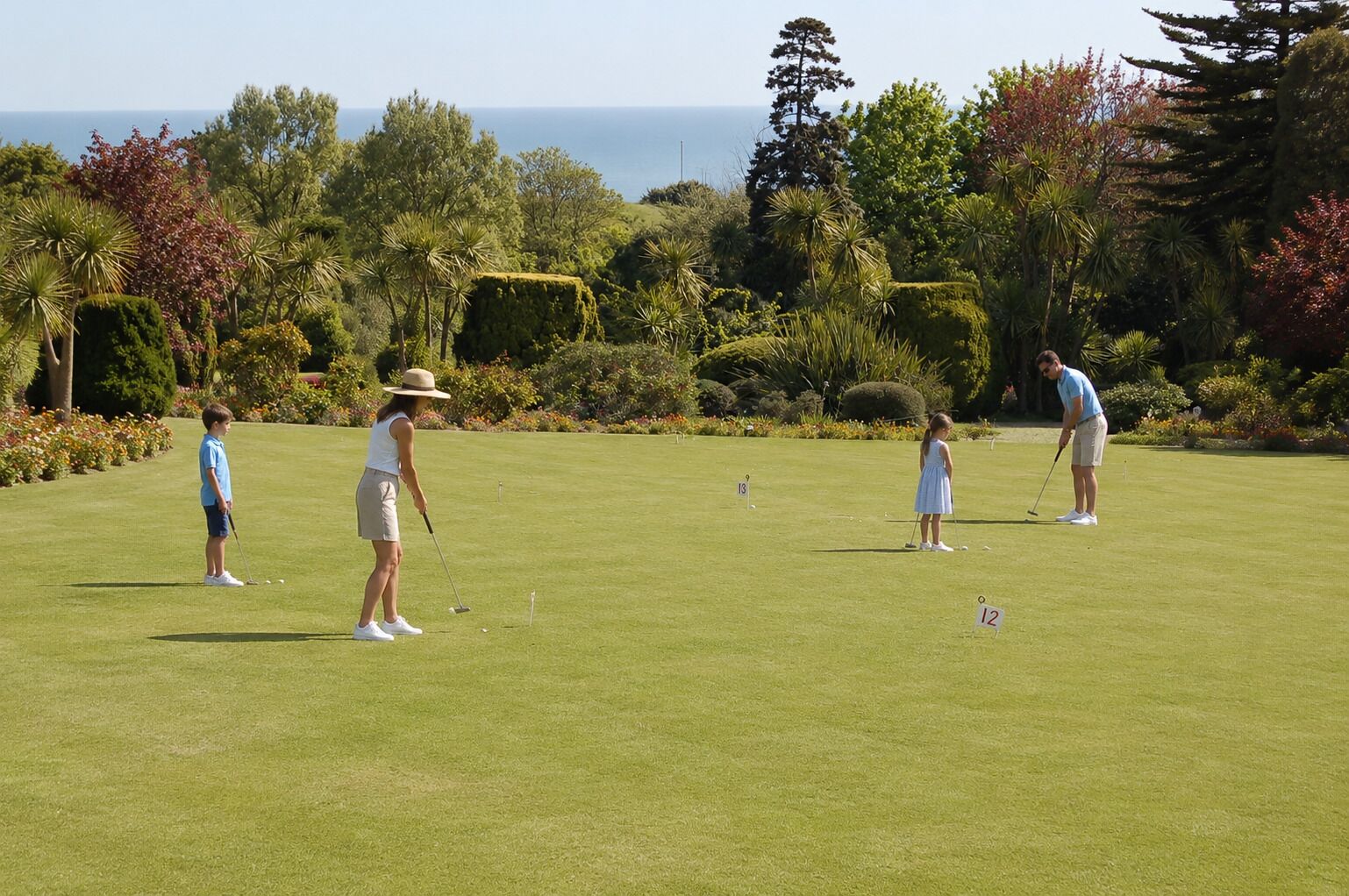 A golf course with a clear view of the ocean in the background.