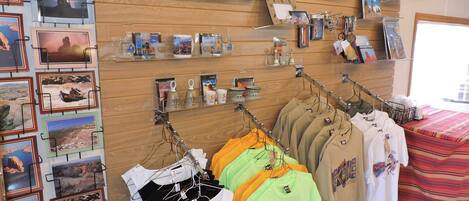 A retail space with clothing racks and shelves displaying merchandise.