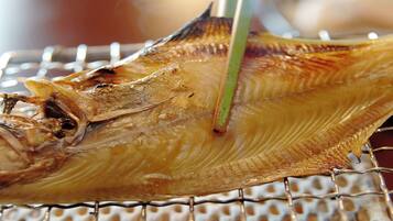 A dried fish on a wire rack.