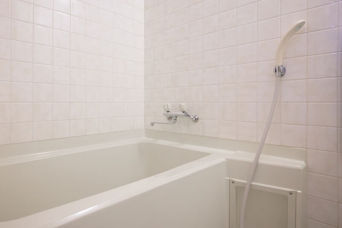 A bathroom with a bathtub, a shower, and a toilet.