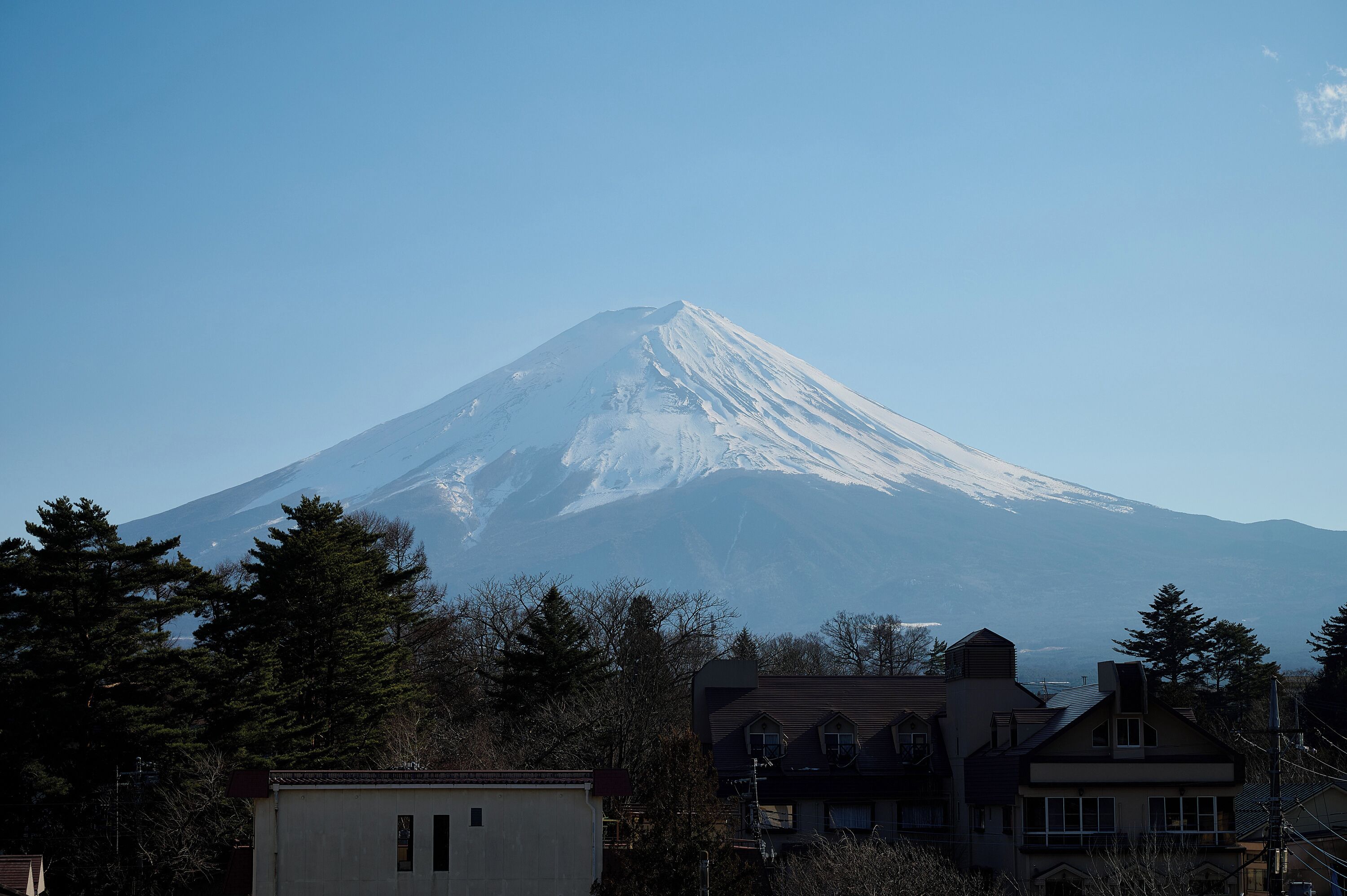 A snow-capped mountain with a clear sky.