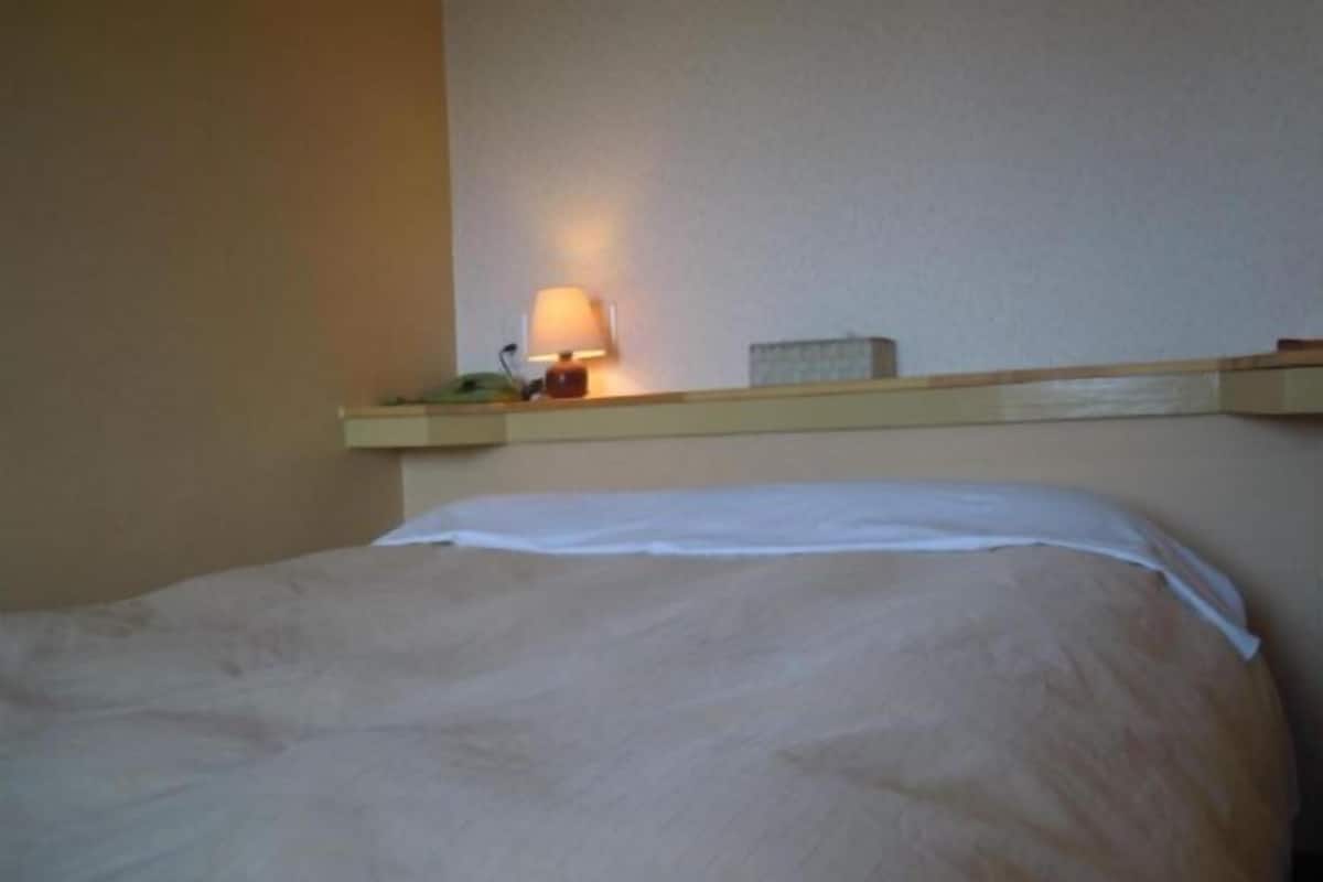 Premium bedding, desk, blackout drapes, iron/ironing board