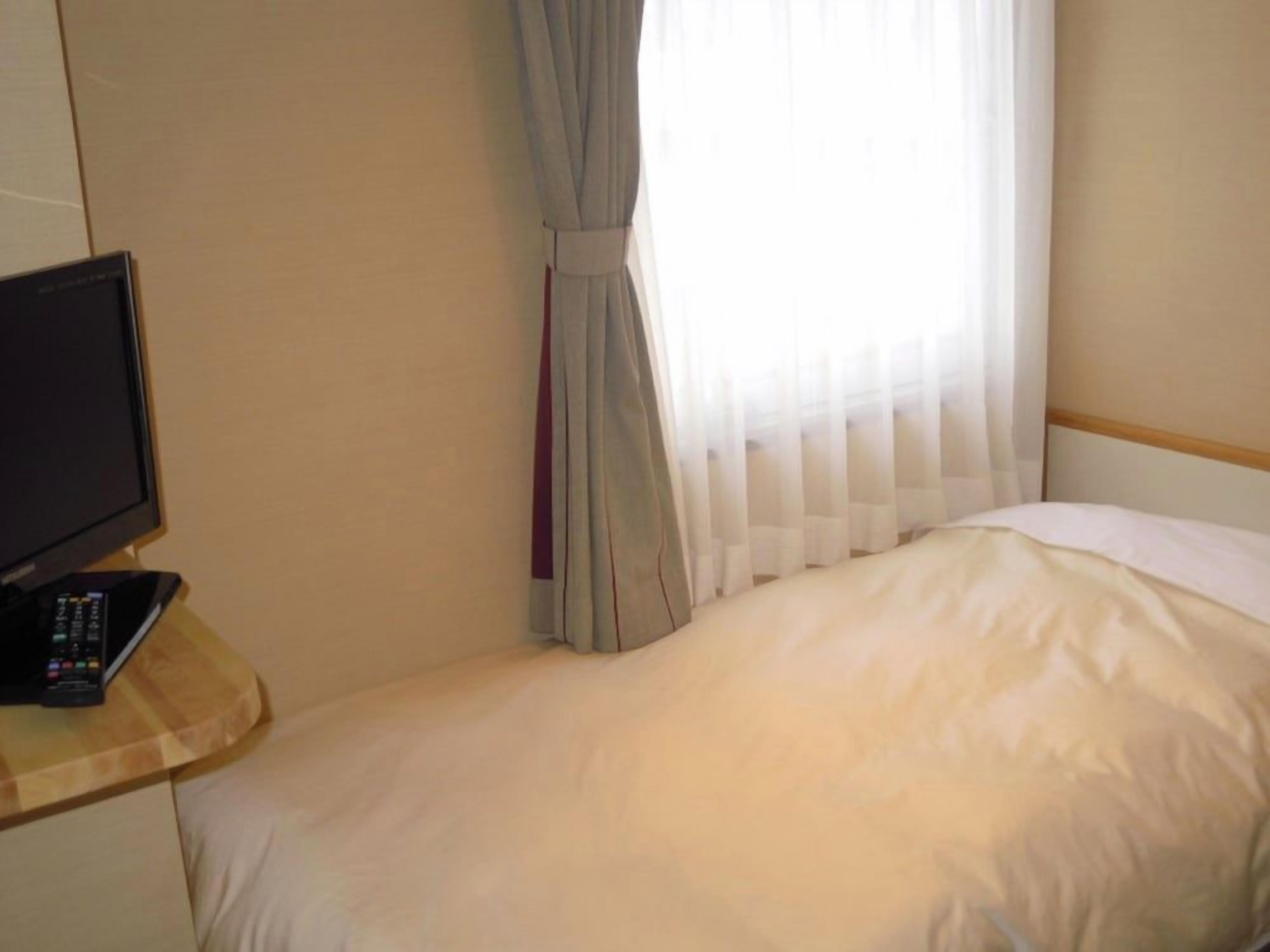 Premium bedding, desk, blackout curtains, iron/ironing board