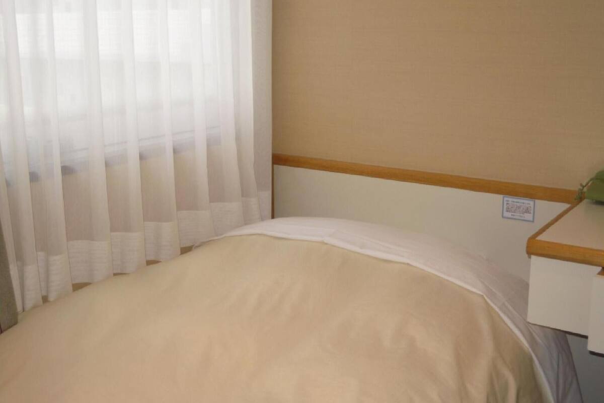 premium bedding, desk, blackout curtains, iron/ironing board