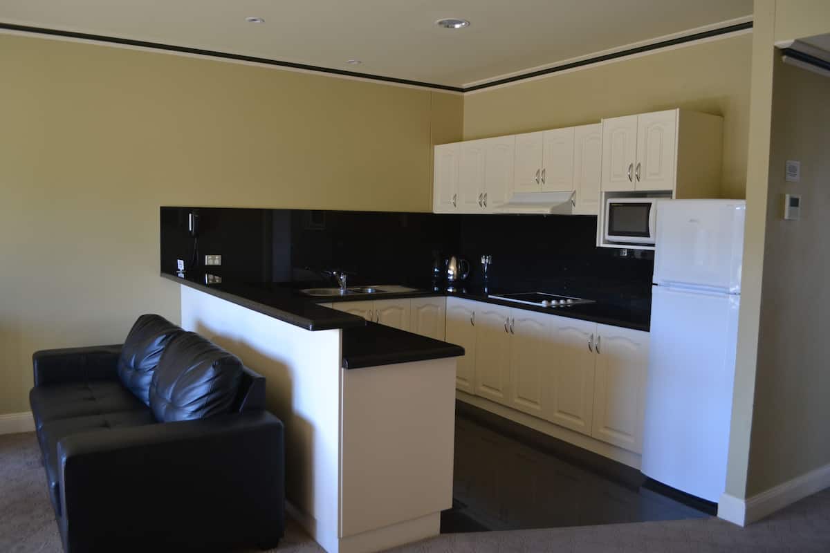 Deluxe Apartment, Garden Area | Private kitchen | Coffee/tea maker