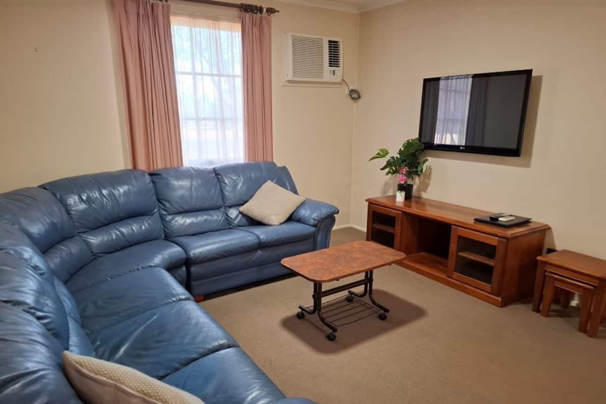 Two Bedroom Garden Unit | Living area | 42-inch flat-screen TV with cable channels, TV, DVD player