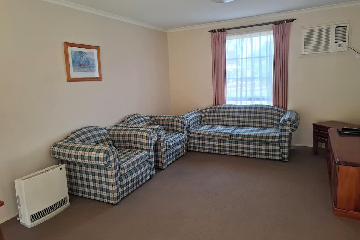 Standard Cabin | Living area | 42-inch flat-screen TV with cable channels, TV, DVD player