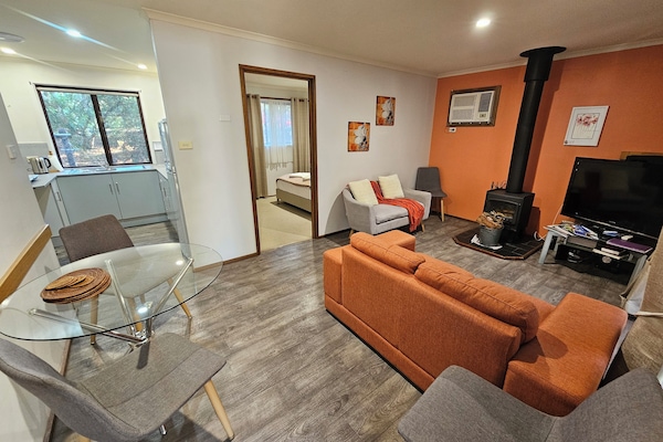 Cottage, 2 Bedrooms, Fireplace (Jacaranda Cottage) | Living area | Flat-screen TV