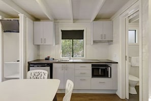 Standard Studio Cabin | Private kitchen | Fridge, microwave, coffee/tea maker, toaster
