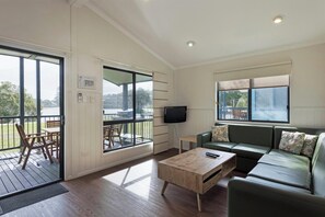 Deluxe 2 Bedroom Waterfront Cabin - Sleeps 6 | Living area | TV - Discovery Parks - Ballina (East Ballina)